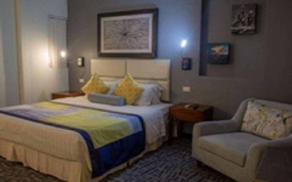 Century Hotel Garapan Room photo