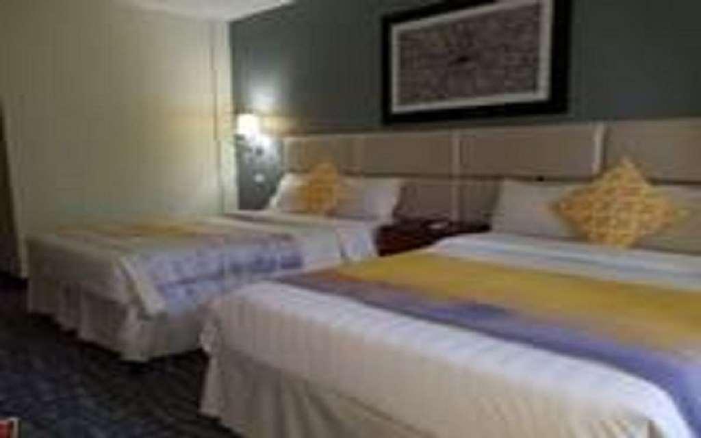 Century Hotel Garapan Room photo